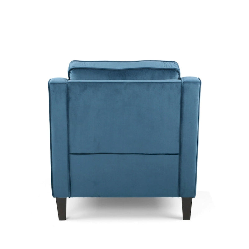 Fauteuil club contemporain en velours avec accoudoirs inclinés et pieds en bois de bouleau