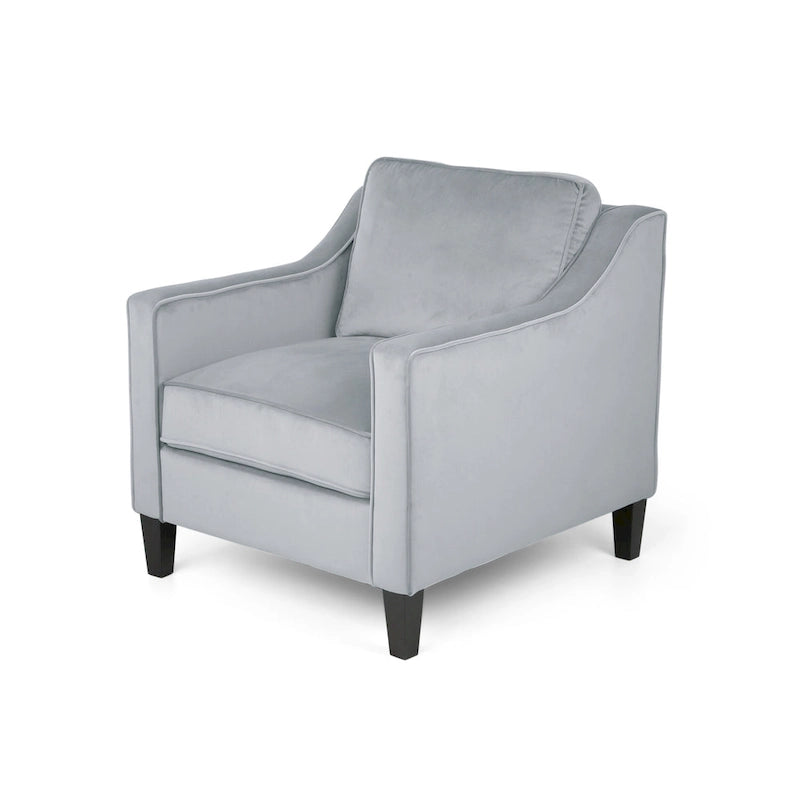 Fauteuil club contemporain en velours avec accoudoirs inclinés et pieds en bois de bouleau