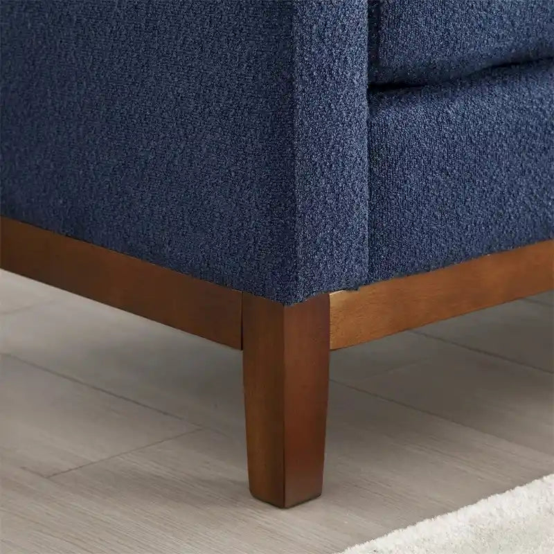 Banc rembourré avec pieds en bois cannelés et traversins